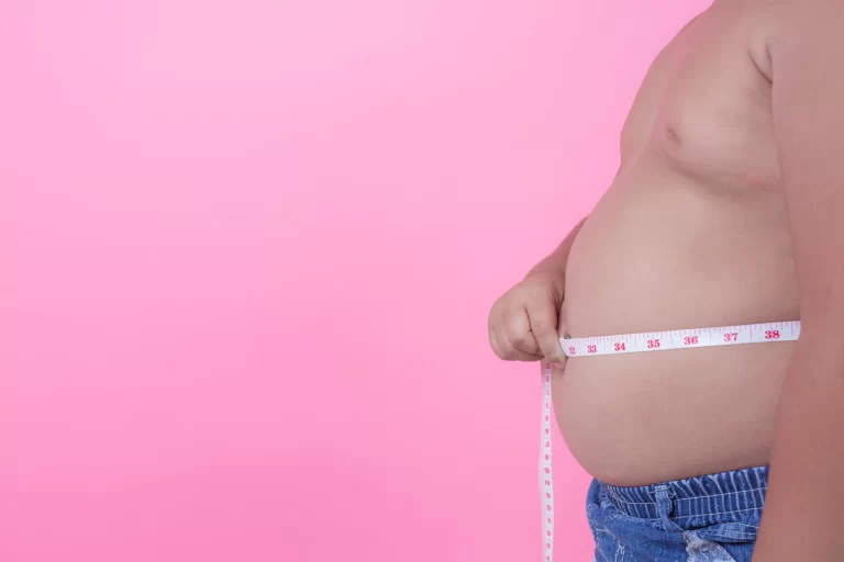 obese boy who is overweight pink background 1150 9940